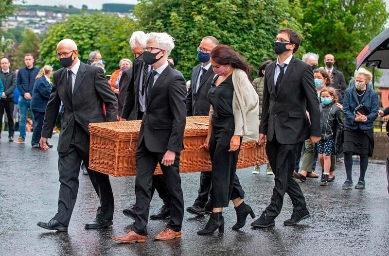 The remains of John Hume are taken into St Eugene's Cathedral. AFP