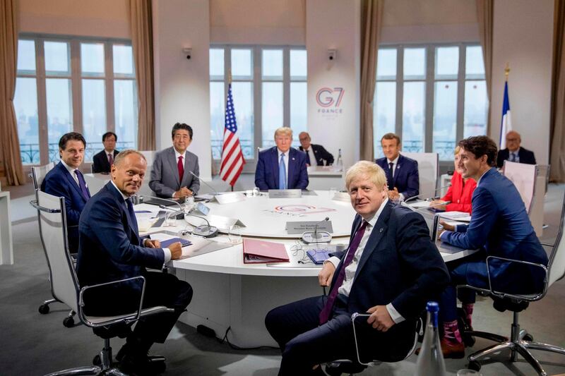 (Left to right) Italy's Prime Minister Giuseppe Conte, European Council President Donald Tusk, Japan's Prime Minister Shinzo Abe, US President Donald Trump, Britain's Prime Minister Boris Johnson, France's President Emmanuel Macron, Germany's Chancellor Angela Merkel and Canada's Prime Minister Justin Trudeau attend a working session on "International Economy and Trade, and International Security Agenda" in Biarritz, south-west France.  AFP