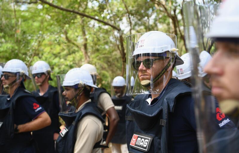 England player Jonny Bairstow fitted out with de-mining personal protective equipment looks on on a tour of a previously cleared area of mine site during the England cricket team's visit to an event held by Mine Action Group (MAG) on Monday in Periyamadu, Sri Lanka. Getty Images