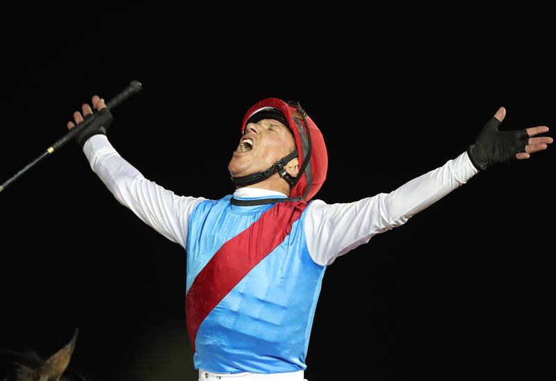 Frankie Dettori celebrates after winning the Dubai World Cup on Country Grammer. Chris Whiteoak / The National