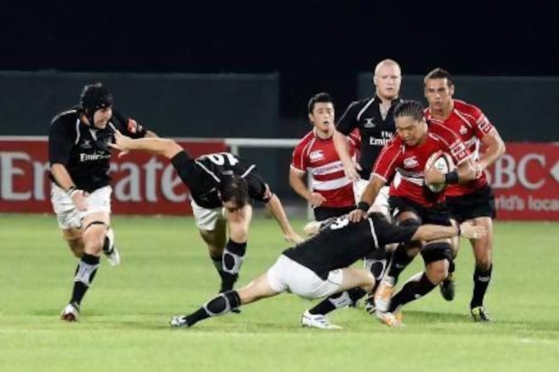 Takashi Kikutani, with the ball, and his Japan teammates gave David Clouston, attempting the tackle, and the UAE a rough going over two years ago.