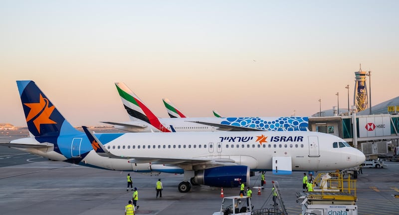 An Israir A320 aircraft parked beside Emirates jets at DXB after successfully landing the airline's inaugural flight to the UAE from Tel Aviv. Courtesy Dubai Government Media Office