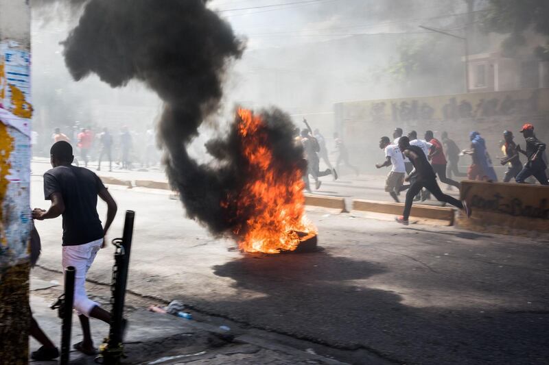 Protesters set fires to block streets as they demonstrate in Port-au-Prince, Haiti, calling for the resignation of President Jovenel Moise. AFP