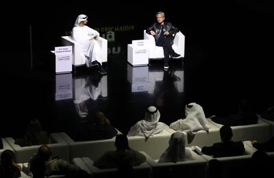 Omar Al Olama, Minister of State for Artificial Intelligence, Digital Economy and Remote Work Applications, and the world's first AI minister, and Jensen Huang, chief executive of Nvidia, at a panel on the sidelines of February's World Governments Summit in Dubai. Chris Whiteoak / The National