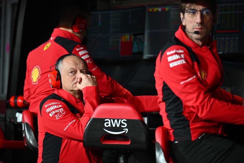 Ferrari's team principal Frederic Vasseur listens to his technical team after Carlos Sainz's car was damaged during practice. AFP