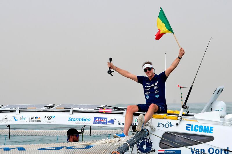 Patrick bol, Dutch skipper of the Row4ocean rowing trimaran waves to the crowd as they leave Dakar to cross the Atlantic on December 14, 2018. AFP