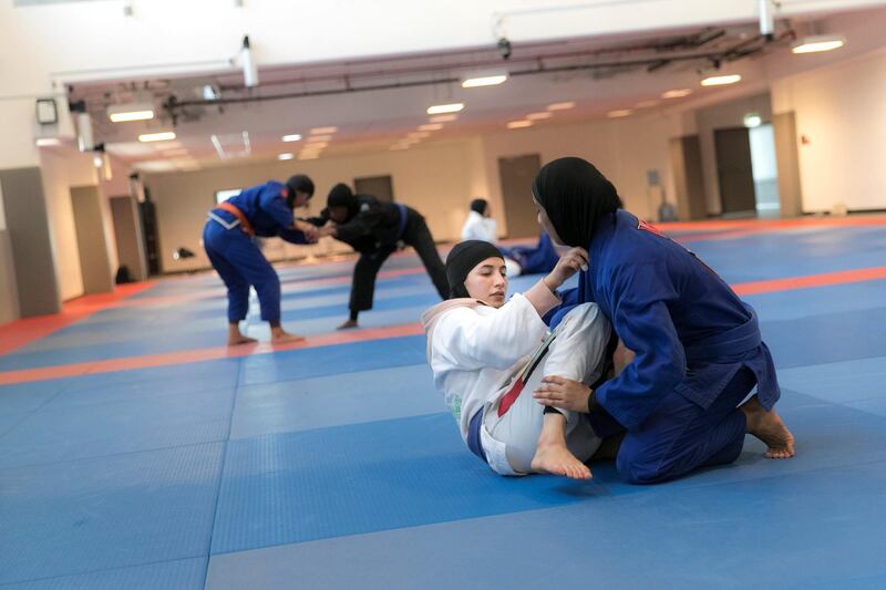 ABU DHABI, UNITED ARAB EMIRATES - AUGUST 14, 2018. 

Mahra Al Hanaei, in white, of the UAE Jiu Jitsu national team, trains for the Asian Games 2018.

(Photo by Reem Mohammed/The National)

Reporter: AMITH PASSATH
Section:  SP