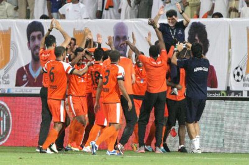 Dubai, United Arab Emirates, May 14, 2013 -    Ajman players celebrate bearing their coach, Abdul Wahab Abdul Qader,  in their shoulders after winning against Jazira during the Pro League Etisalat Cup final at Al Wasl's Zabeel Stadium. ( Jaime Puebla / The National Newspaper ) 