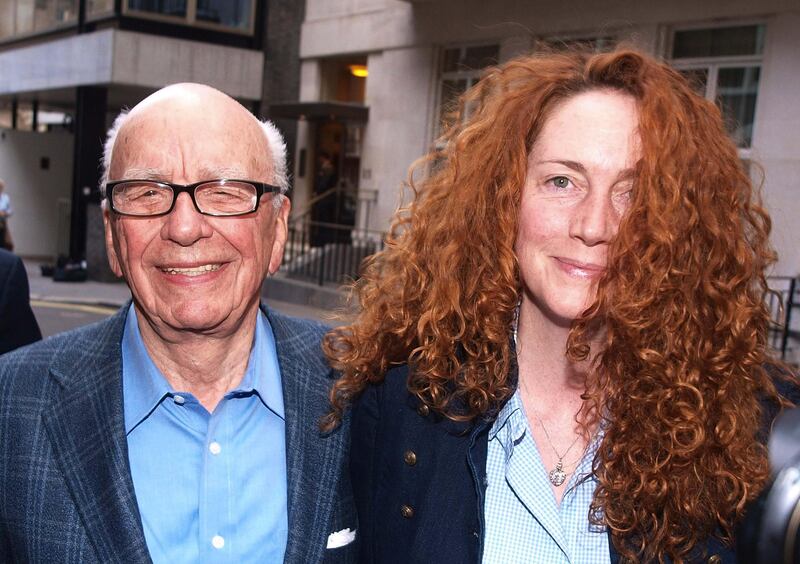 FILE - Chairman of News Corporation Rupert Murdoch, left, and Chief executive of News International Rebekah Brooks as they leave his residence in central London, in this Sunday, July 10, 2011 file photo.  Brooks resigned as Chief executive of News International Friday July 15, 2011 according to News International journalists. (AP Photo/Ian Nicholson) UNITED KINGDOM OUT - NO SALES - NO ARCHIVES *** Local Caption ***  Britain Phone Hacking.JPEG-07799.jpg