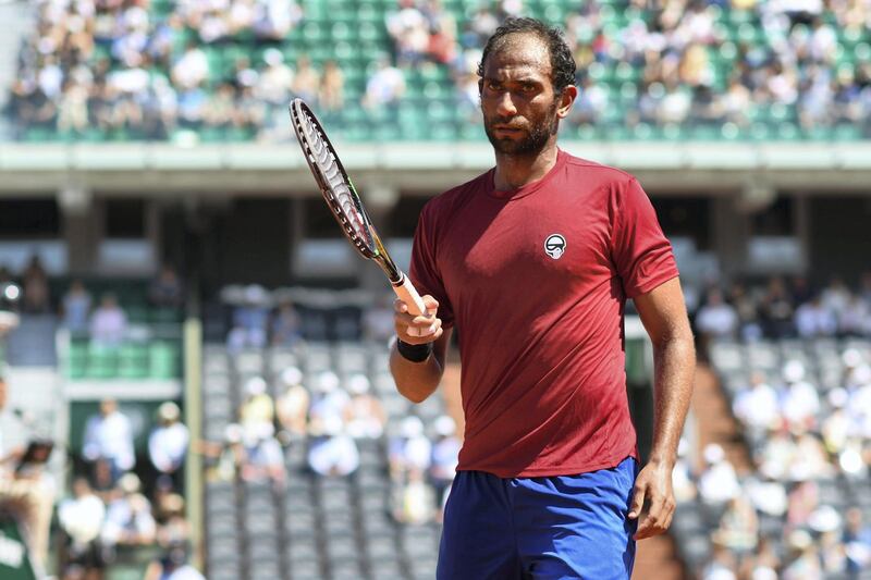 Egypt's Mohamed Safwat reacts during his men's singles first round tennis match against Bulgaria's Grigor Dimitrov on day one of The Roland Garros 2018 French Open tennis tournament in Paris on May 27, 2018. (Photo by CHRISTOPHE ARCHAMBAULT / AFP)        (Photo credit should read CHRISTOPHE ARCHAMBAULT/AFP/Getty Images)