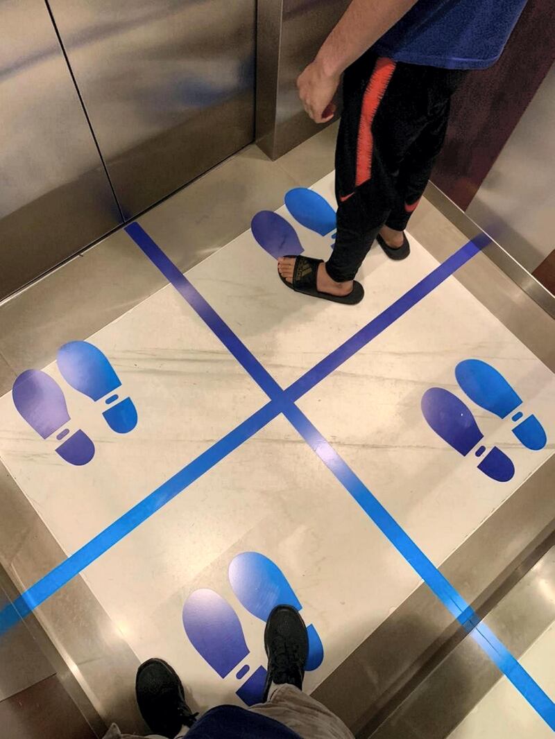 Lifts in Central Park Towers, DIFC, encouraging social distancing