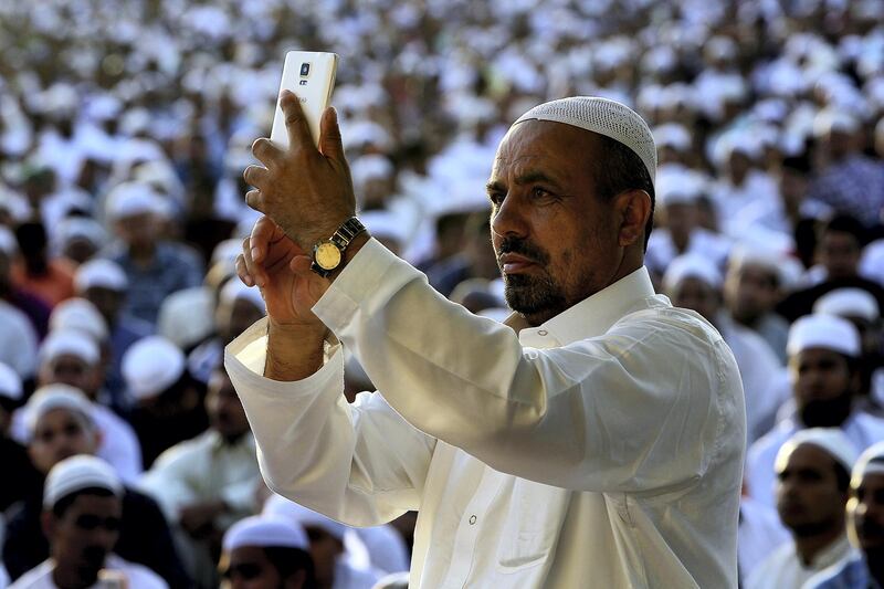 Dubai, June, 15, 2018: Worshipper takes a selfie after the  Eid Prayers at the Eidgah in Deira in Dubai. Satish Kumar for the National