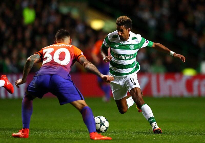 Scott Sinclair of Celtic runs with the ball under pressure form Nicolas Otamendi of Manchester City. Michael Steele / Getty Images
