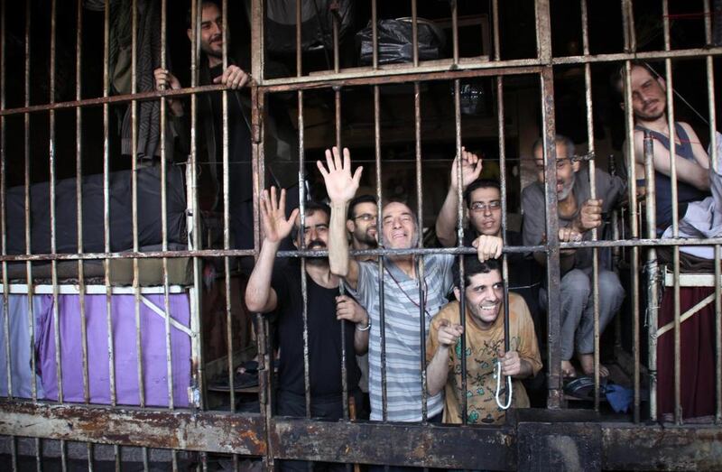 Inmates in Aleppo’s main prison on Thursday after Syrian troops broke through a year-long rebel siege on the facility. George Ourfalian / Reuters / May 22, 2014