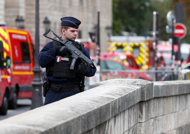 epa07892449 French police and security forces establish a security perimeter near the police headquarters where a man was attacking officers with a knife in Paris, France, 03 October 2019. According to recent reports, five people were killed, including the attacker.  EPA/IAN LANGSDON