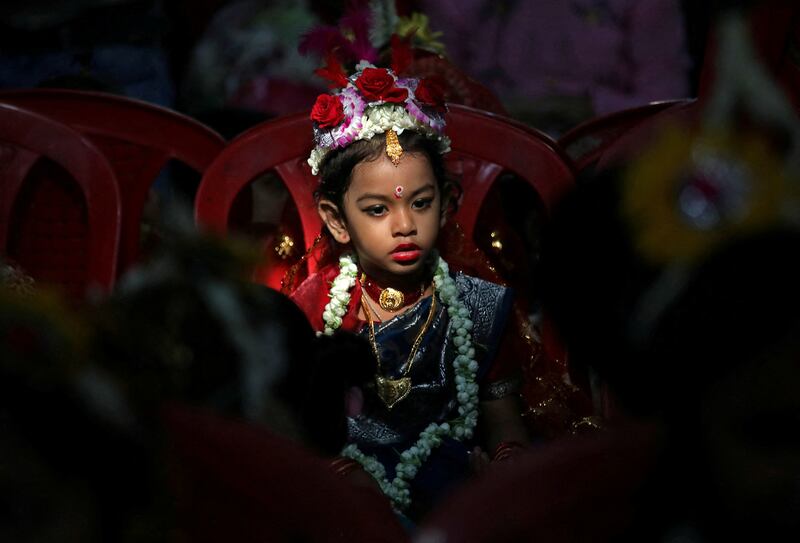 A girl dressed as a deity is worshipped by devotees during rituals to celebrate Navratri in Kolkata. Reuters