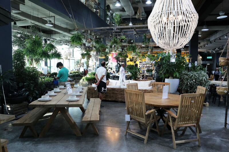 Outdoor furniture and plants for sale at the Garden Concept store in Dubai. Pawan Singh / The National