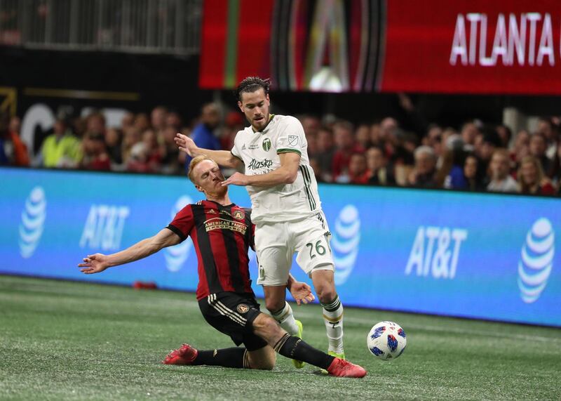 Portland Timbers' Lucas Melano and Atlanta United's Jeff Larentowicz compete for the ball. Reuters