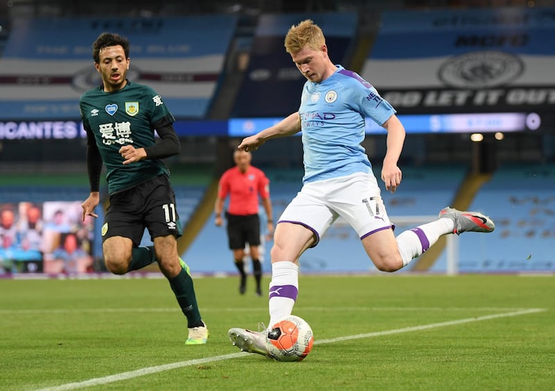 Manchester City's Kevin De Bruyne, right, takes on Burnley's Dwight McNeil. AP Photo