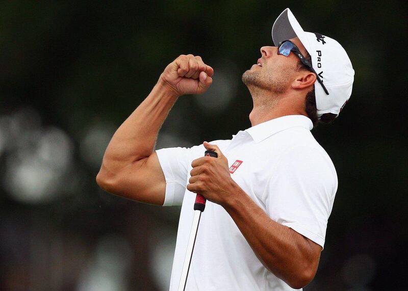 Adam Scott celebrates a birdie putt on the thrid play-off hole to defeat Jason Dufner and win the Crowne Plaza Invitational at Colonial on Sunday. Marianna Massey / Getty Images / AFP / May 25, 2014 