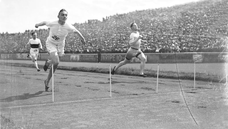 1924:  British sprinter Harold Abrahams crosses the finish line to win the 100 yards race at the AAA Championships. Harold Abrahams (1899 - 1978) the 1924 Paris Olympic 100 metres champion whose feat was later immortalised in the film Chariots of Fire (1981).  (Photo by Central Press/Getty Images)