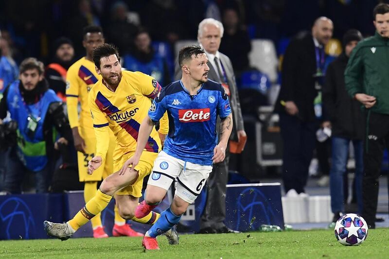 Napoli's Mario Rui (R) and Barcelona's Lionel Messi in action. EPA