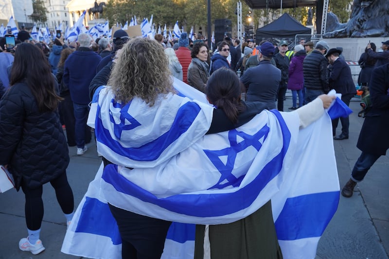 Some carried Israeli flags while others held placards showing the faces of those taken hostage. PA