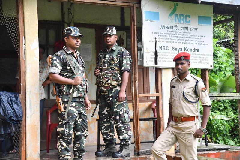 In this photo taken on August 28, 2019, security personnel stand guard at a National Register of Citizens (NRC) office ahead of the release of the register's final draft in Guwahati, the capital city of India’s northeastern state of Assam. India's government sought August 29 to ease concerns about an imminent "citizens' register" in the state of Assam that has left several million people, mostly Muslims, fearful of becoming stateless. / AFP / Biju BORO
