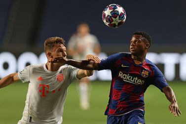 Bayern Munich's German midfielder Joshua Kimmich (L) challenges Barcelona's Guinean-Spanish forward Ansu Fati during the UEFA Champions League quarter-final football match between Barcelona and Bayern Munich at the Luz stadium in Lisbon on August 14, 2020. / AFP / POOL / Rafael Marchante