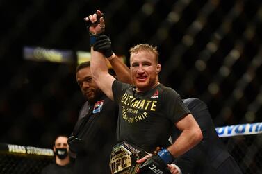 Justin Gaethje has his arm raised in victory after defeating Tony Ferguson at UFC 249. Reuters