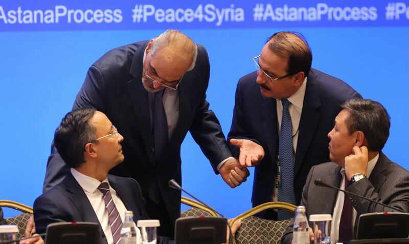 Syrian chief negotiator and Ambassador of the Permanent Representative Mission of Syria to the United Nations Bashar al-Jaafari (2L) and Syrian ambassador to Russia Riad Haddad (2R) speak with unidentified Kazakh officials during the session of Syria peace talks in Astana, on September 15, 2017.
Russia, Iran and Turkey have  in Astana reached a deal to jointly police a fourth safe zone as part of a Russia-driven plan to still fighting in the six-year Syrian conflict. According to a joint declaration produced at the end of two days of talks in Kazakh capital, the trio agreed to deploy "de-escalation control forces" in a zone encompassing the troublesome province of Idlib as well as "certain parts" of Latakia, Hama and Aleppo provinces.
 / AFP PHOTO / Stanislav FILIPPOV