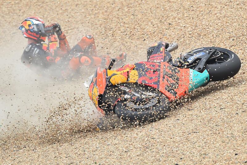 TOPSHOT - Red Bull KTM Factory Racing's Spanish rider Pol Espargaro falls during the second MotoGP free practice session, ahead of the French Motorcycle Grand Prix, on May 17, 2019, in Le Mans, northwestern France.  / AFP / JEAN-FRANCOIS MONIER             
