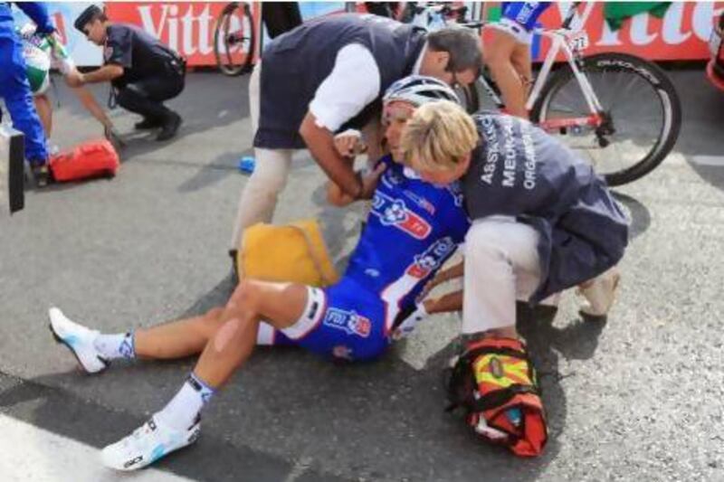 French rider Nacer Bouhanni is attended to by medical personnel after being involved in a crash in the last kilometre of Stage 5. Doug Pensinger / Getty Images