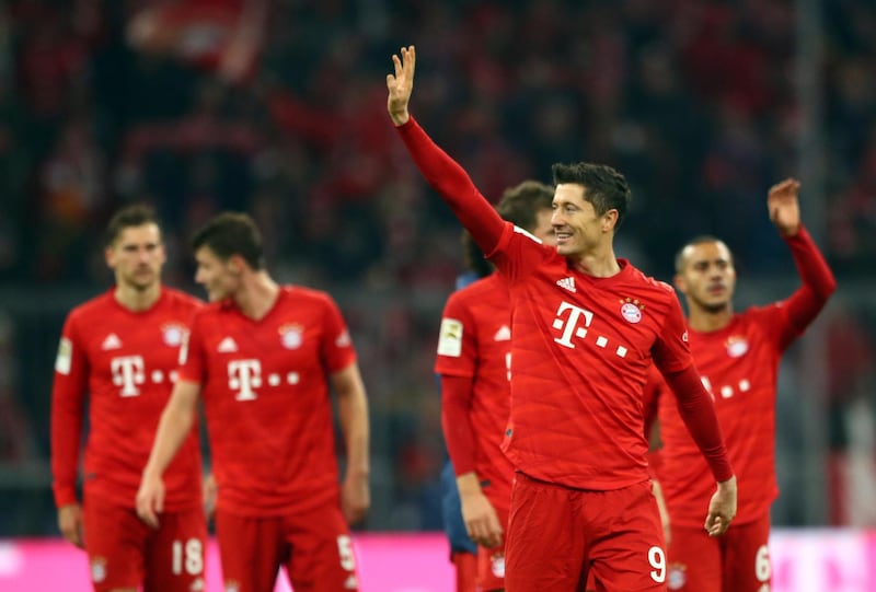 Robert Lewandowski, front right, waves to the crowd after Bayern Munich's 4-0 win over Borussia Dortmund. AP Photo