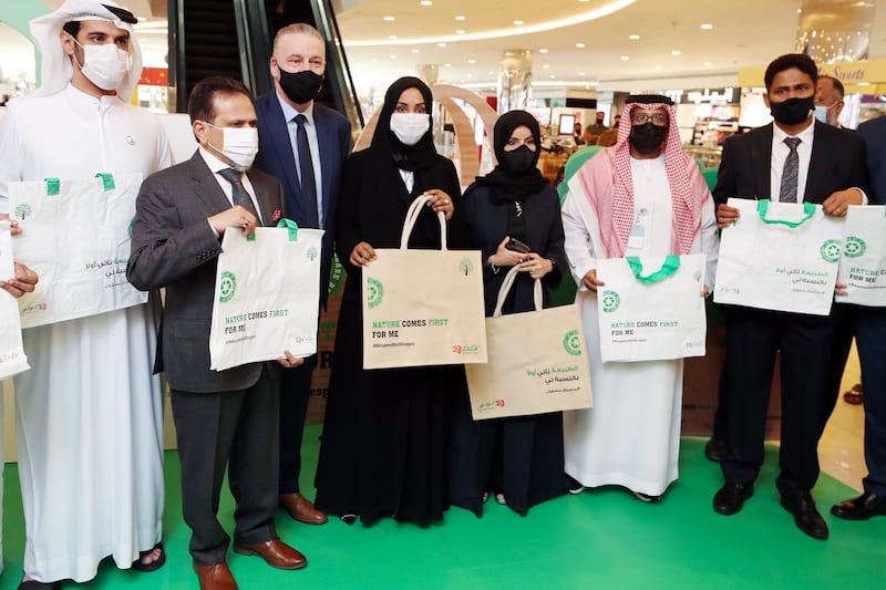 Shaikha Salem Al Dhaheri, centre, white mask, secretary general of Environment Agency Abu Dhabi, visits Lulu Supermarket in Mushrif Mall on the first day of a ban on plastic shopping bags. All photos: Chris Whiteoak / The National