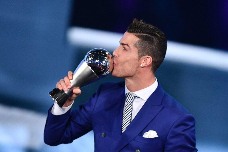 Cristiano Ronaldo kisses his trophy after winning the The Best Fifa Men’s Player of 2016 Award on January 9, 2017 in Zurich. Fabrice Coffrini / AFP