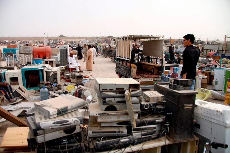 People buy second-hand items at the Friday market in Najaf, Iraq. Haidar Hamdani / AFP