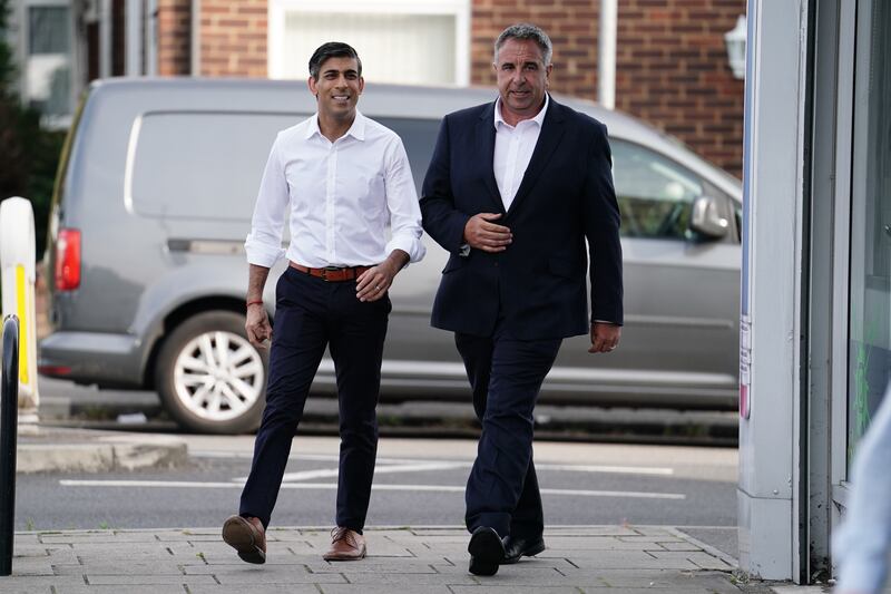 Prime Minister Rishi Sunak with new Conservative MP Steve Tuckwell in Uxbridge on Friday morning. PA