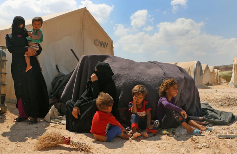 Displaced Syrians are seen at a camp in Kafr Lusin near the Bab al-Hawa border crossing with Turkey in the northern part of Syria's rebel-held Idlib province on September 6, 2018. - Hundreds of civilians have fled villages near the front line in Syria's Idlib province fearing an imminent regime assault on the country's last major rebel bastion, a monitor said. (Photo by Aaref WATAD / AFP)