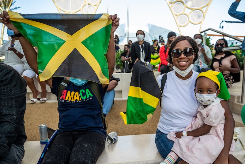 Visitors flying the flag for Jamaica national day at Al Wasl Dome, Expo 2020 Dubai. Victor Besa / The National