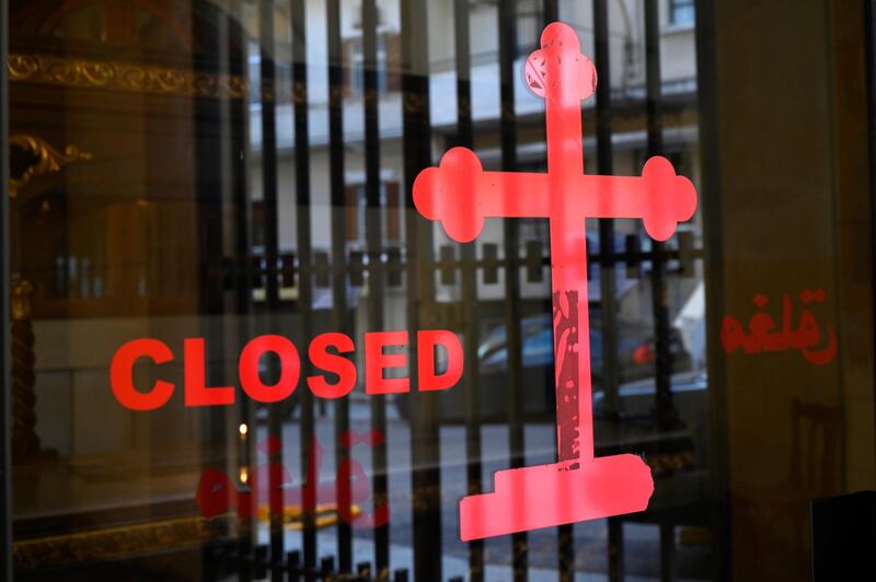 A closed sign is seen at the entrance to the Al Saydeh Church in Ashrafieh area, Beirut, Lebanon. EPA