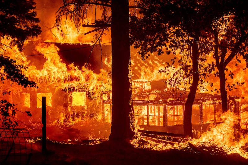 The Dixie Fire consumes a home in the Indian Falls community of Plumas County, California, on July 24. AP