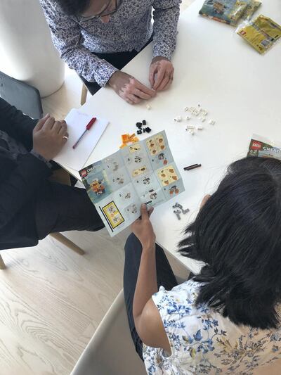 Parents taking part in a free session hosted by Lego to teach them how to use Lego at home to communicate better with their children who suffer from autism spectrum disorders. The sessions are led by Emily Alderson, a speech therapist at Hope Abilitation Medical Centre in Dubai, who uses Lego therapy with her patients. Credit: Lego Middle East and Africa. 