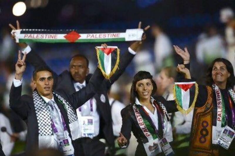 Members of the Palestinian team parade during the opening ceremony of the London 2012 Olympic Games.