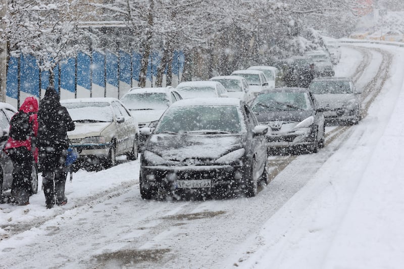 The snow disrupted traffic in the Iranian capital. Reuters