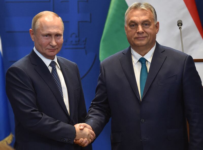 Hungarian Prime Minister Viktor Orban, right, and Russian President Vladimir Putin shake hands in Budapest in October 2019. AFP