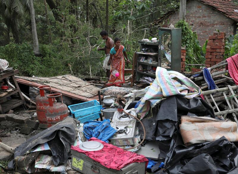 Residents salvage their belongings from the rubble of a damaged house in the aftermath of Cyclone Amphan, in South 24 Parganas district in the eastern state of West Bengal, India. REUTERS