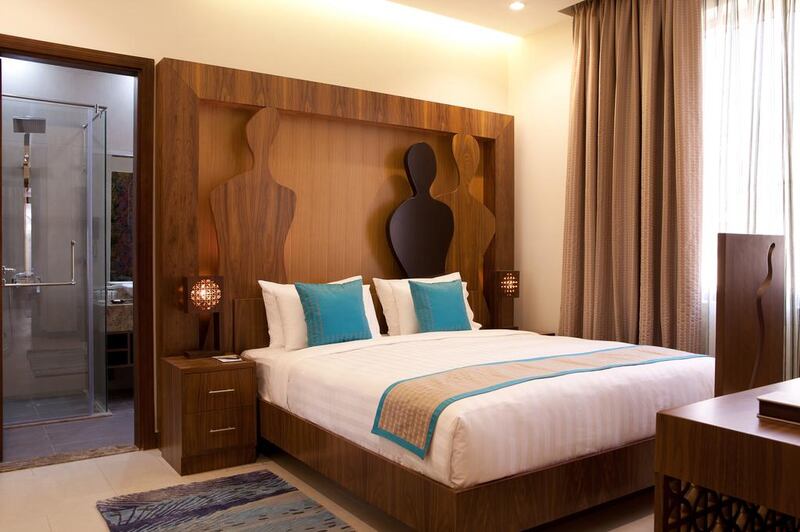 Najat Maky's female forms are depicted here on the bedhead of one of the rooms in Noon Art Hotel Apartments. Courtesy: Noon Hotel Apartments