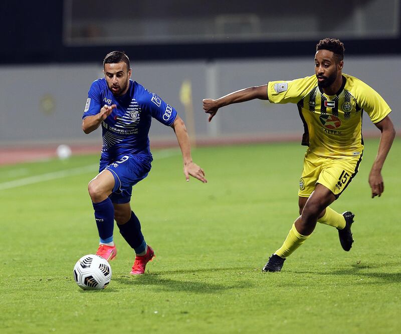 Al Nasr’s Diaa Saabia (left) is challenged by Kalba’s Majed Almherzi in the Arabian Gulf Cup second leg semi-final at the Ittihad Kalba stadium on Tuesday, March 2, 2021. Courtesy PLC