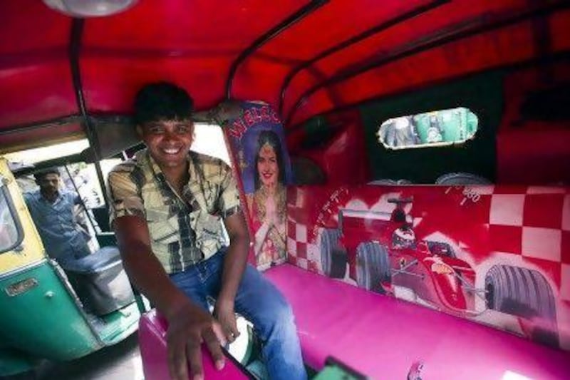 Samvir Singh Thakur, 26, calls his rickshaw "The UP Express", standing for his hoem state Uttar Pradesh. Inside, his it is decorated with images of Bollywood stars Katrina Kaif and Salman Khan. Simon De Trey-White for The National